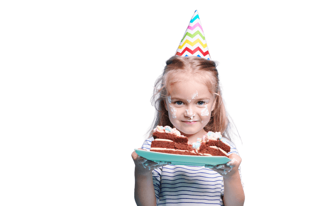 Kid in party hat holding a plate of birthday cake