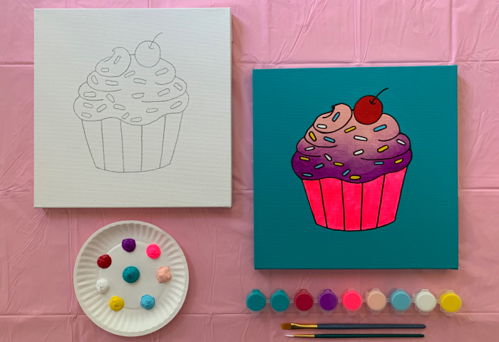 Cupcake canvas sketch next to finished painting with paint supplies